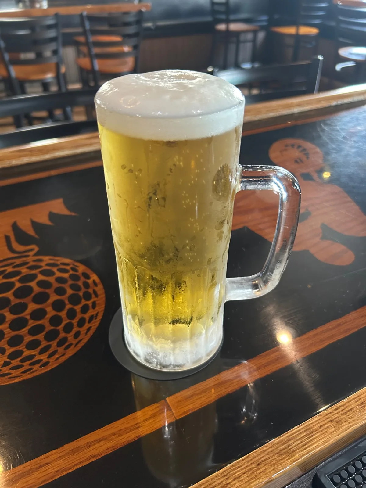 Frosted mug of ice-cold draft beer at Wannabeez Bar & Grill